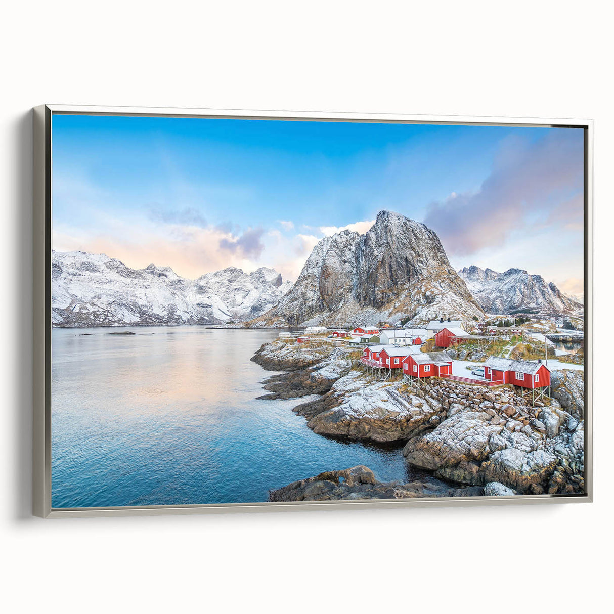 Framed canvas wall art showcasing a stunning landscape design featuring a quaint village and lush greenery, elegantly bordered in silver, ideal for home decor.