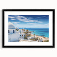 Black-framed wall art featuring a picturesque landscape of a quaint village, showcasing vibrant colors and intricate details, ideal for home decor.