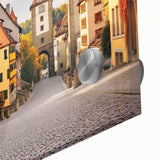 Close-up of a vibrant acrylic glass wall art piece showcasing a picturesque village landscape, featuring lush greenery and charming architecture, perfect for home decor.