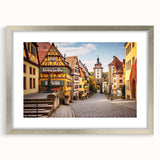 Elegant silver-framed wall art showcasing a serene village landscape design, featuring vibrant colors and intricate details, perfect for home decor enhancement.
