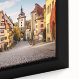 Framed canvas artwork showcasing a vibrant village landscape design, featuring rich colors and intricate details, perfect for home décor and artistic ambiance.
