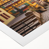 Vibrant rolled canvas artwork showcasing a serene village landscape with lush greenery and quaint houses, designed to enhance home decor and evoke tranquility.