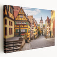 Stretched canvas wall art showcasing a vibrant village landscape design, featuring rich colors and intricate details, ideal for home decor enhancement.