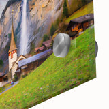 Close-up of a vibrant acrylic wall art piece showcasing a picturesque village landscape, featuring lush greenery, quaint houses, and a serene sky, perfect for home decor.