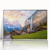 Framed acrylic wall art featuring a picturesque village landscape design, showcasing vibrant colors and intricate details, set against a sleek white frame for modern decor.