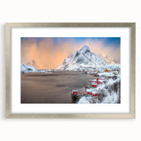 Framed wall art design showcasing a serene village landscape in muted tones, elegantly presented with a silver frame and mat, ideal for home decor.