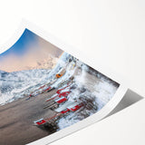 Rolled wall art print showcasing a vibrant landscape scene of a picturesque village, featuring lush greenery and colorful houses, designed to enhance home decor.