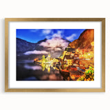 Framed wall art featuring a serene village landscape design, showcasing warm earthy tones and intricate details, set within a gold frame with a crisp white mat. Ideal for enhancing home decor with an elegant touch.