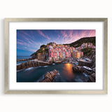 Framed wall art collection showcasing a serene landscape village design, presented in a silver frame with a mat, ideal for home decor enhancement.