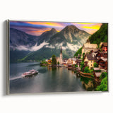 Framed canvas wall art showcasing a serene village landscape with vibrant colors and intricate details, featuring a silver frame that enhances its elegance.