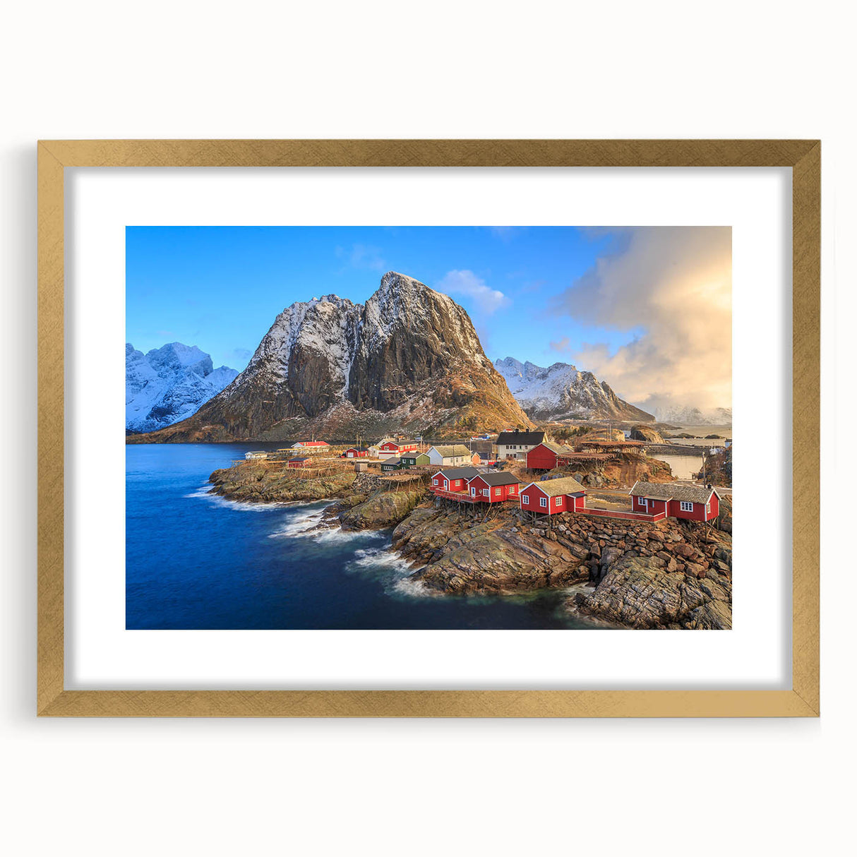 Framed wall art collection showcasing a picturesque village landscape in vibrant colors, featuring a gold mat and frame, perfect for home decor enhancement.