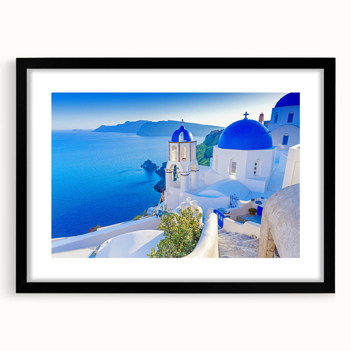 Framed wall art showcasing a serene landscape village scene with a black mat and frame, ideal for home decor and enhancing interior aesthetics.