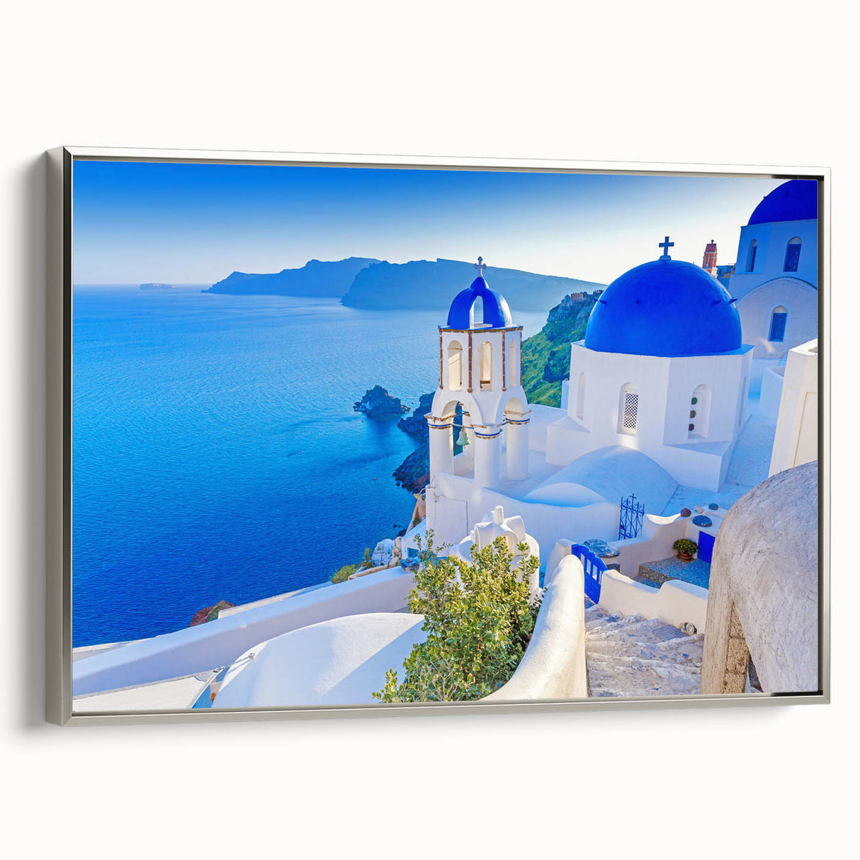 Framed canvas wall art showcasing a serene village landscape design with silver accents, perfect for home decor. The piece features vibrant colors and intricate details, adding charm to any room.