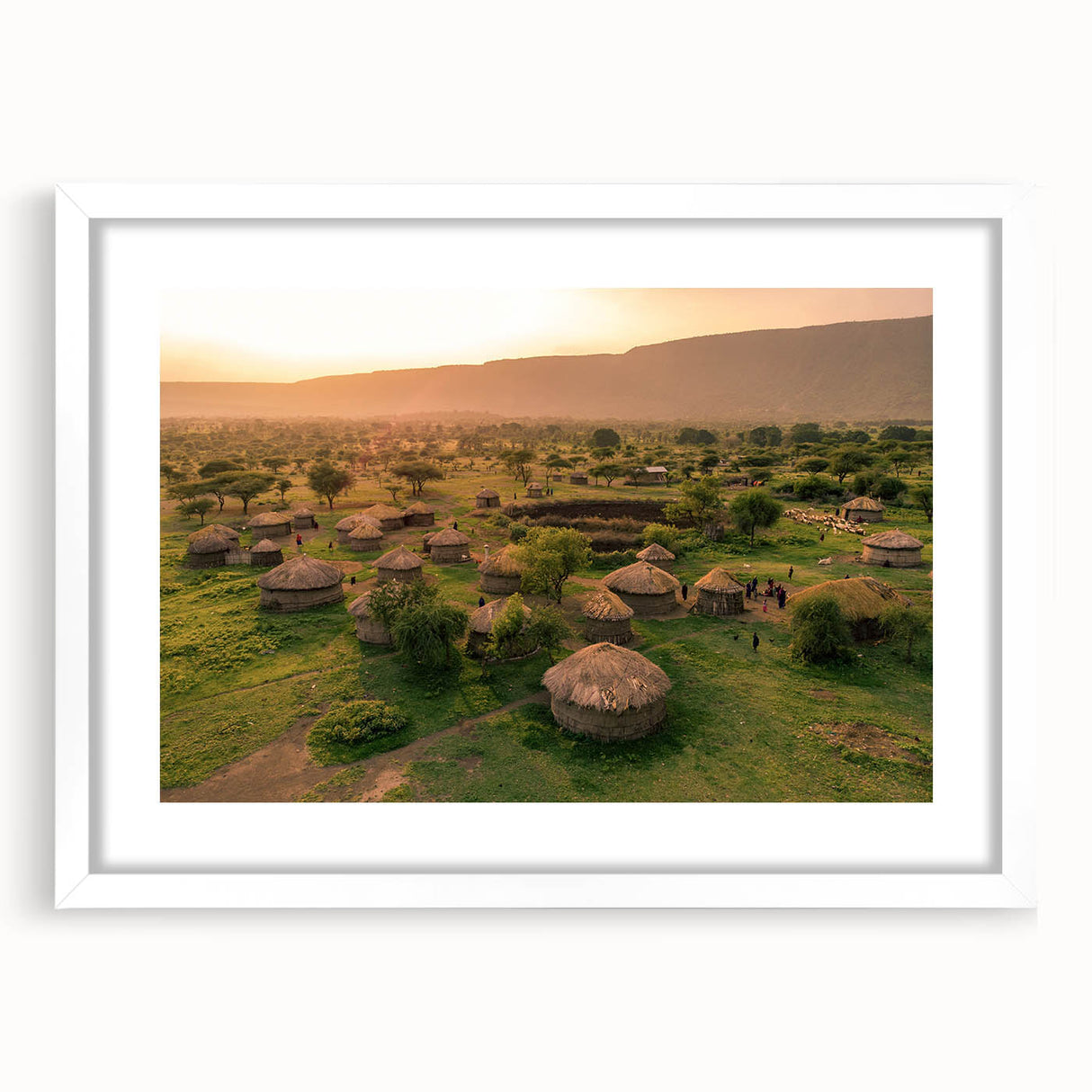 Framed wall art collection showcasing serene village landscapes with a white mat and frame, ideal for enhancing home decor and interior aesthetics.