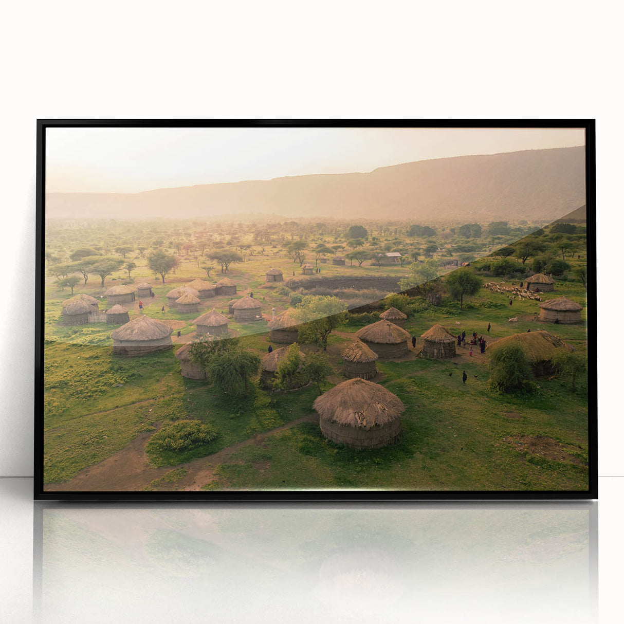 Framed acrylic wall art featuring a stunning landscape village design in vibrant colors, perfect for home decor. The artwork showcases intricate details against a sleek black frame, enhancing any living space's aesthetic.
