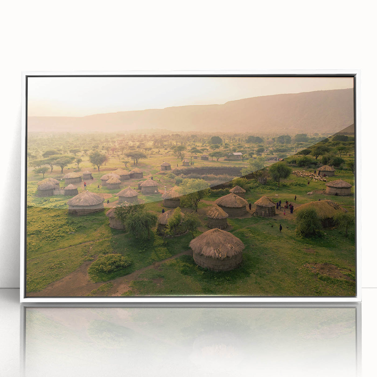 Framed wall art collection showcasing a serene village landscape design with vibrant colors and intricate details, set against a sleek white frame for a modern aesthetic. Ideal for enhancing home decor with artistic flair.