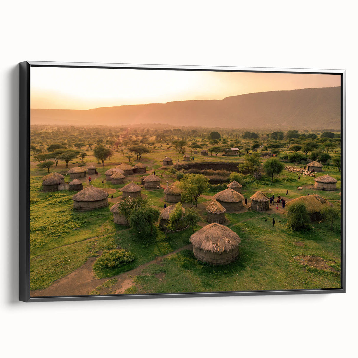 Framed canvas wall art showcasing a vibrant landscape village design with rich colors and intricate details, displayed in a sleek black frame, ideal for home decor.