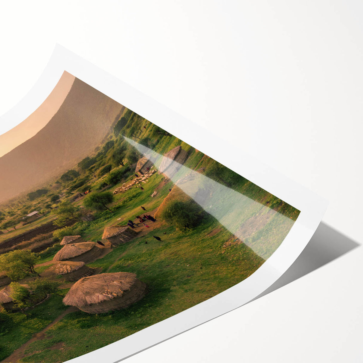 Colorful rolled print showcasing a stunning landscape village design, featuring vibrant hues and intricate detailing, perfect for home decor.