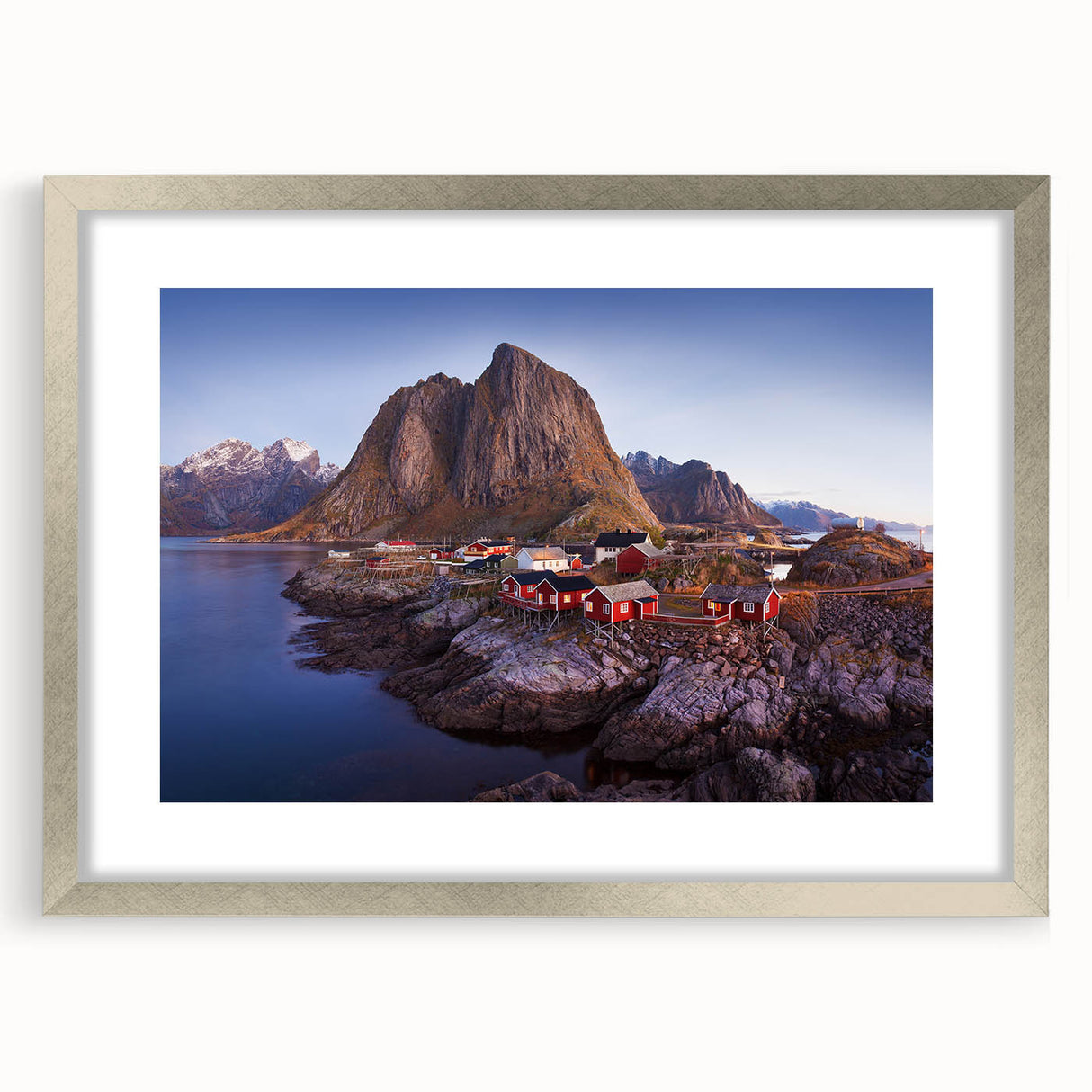 Framed wall art design showcasing a serene village landscape with vibrant colors, featuring a silver frame and mat, perfect for home decor enhancement.