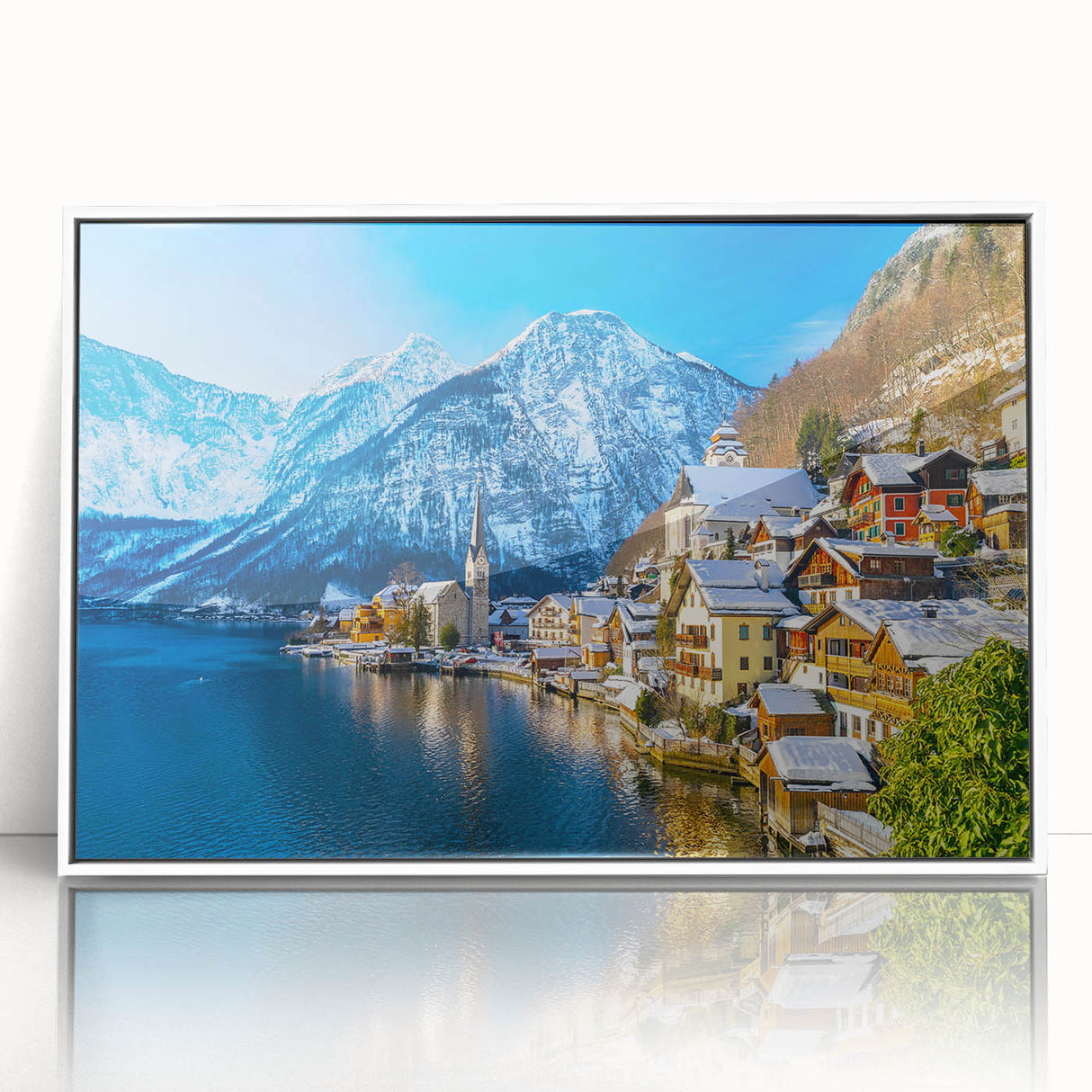 Framed acrylic wall art showcasing a serene village landscape with vibrant colors, perfect for home decor. Features a white frame that enhances the artistic details.