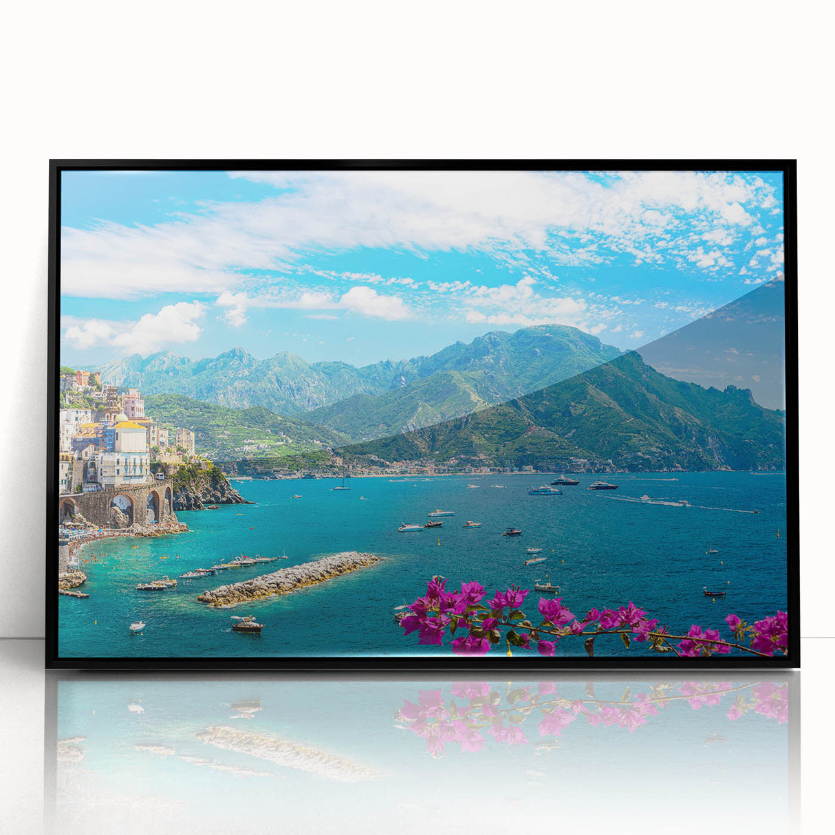 Framed wall art showcasing a vibrant landscape village scene, featuring lush greenery and rustic homes, designed with a sleek black frame for modern decor.