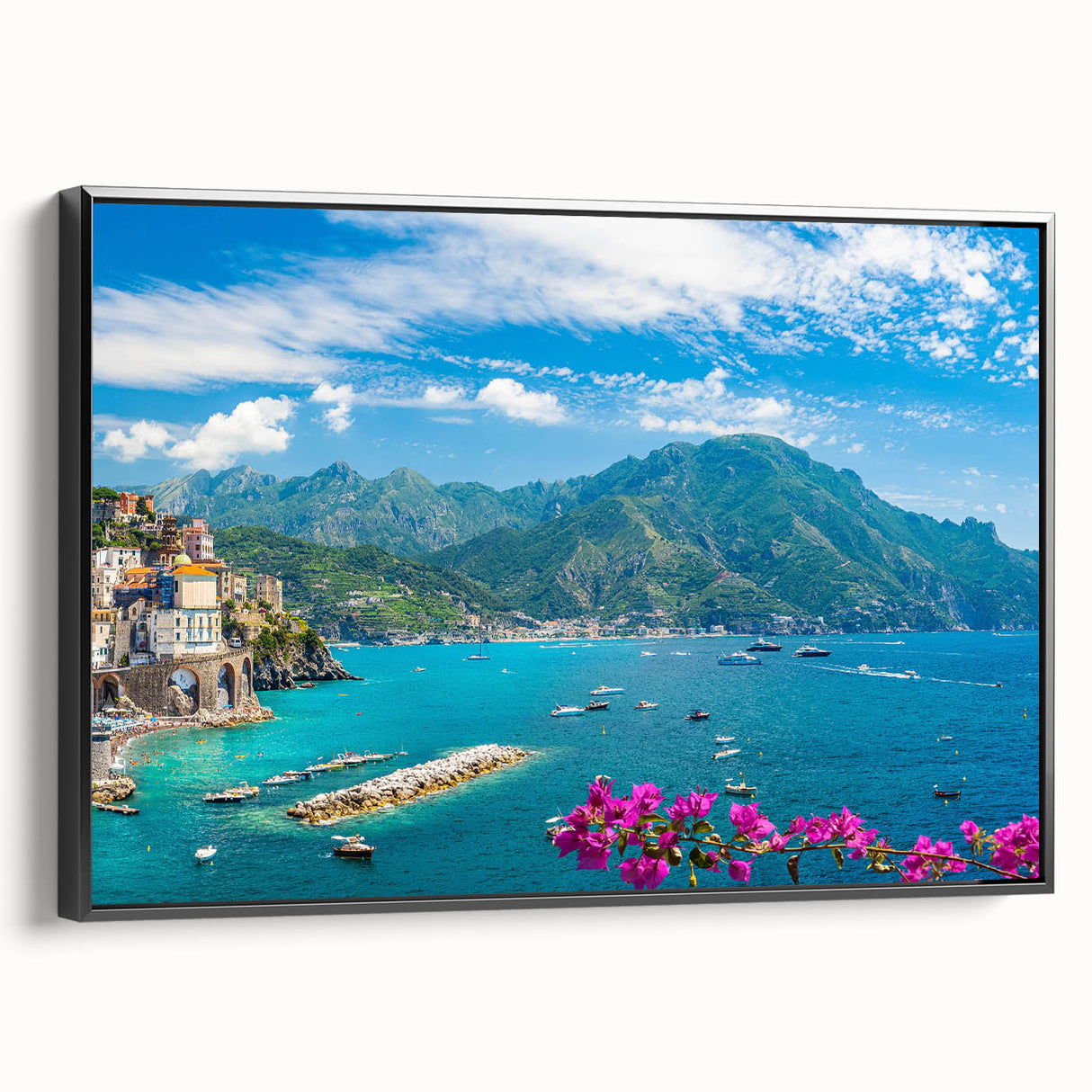 Framed canvas wall art depicting a picturesque village landscape with vibrant colors and intricate details, showcasing a black frame and side view for elegant decor.