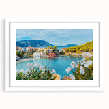 Framed wall art collection showcasing serene landscapes and charming villages, featuring a white mat and sleek frame, perfect for home decor enhancement.