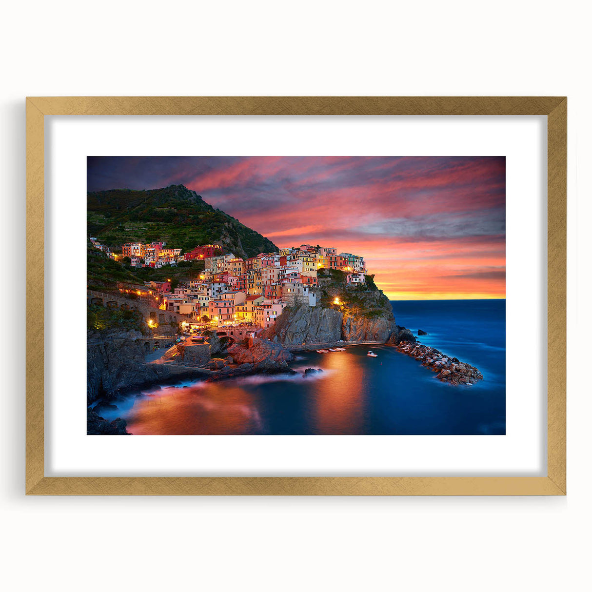 Framed wall art collection showcasing serene village landscapes, featuring a gold mat and elegant frame, perfect for enhancing home decor aesthetics.