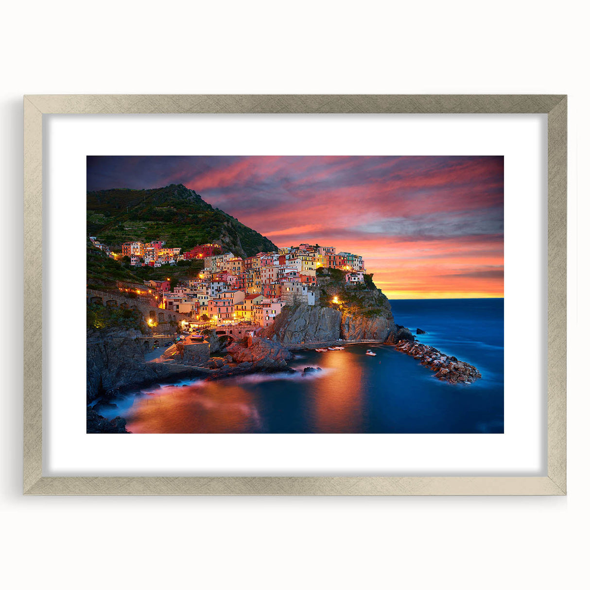 Framed wall art collection showcasing a serene village landscape design in a silver frame with a mat, perfect for home decor and enhancing living spaces.