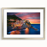 Framed wall art collection showcasing a serene village landscape design in a silver frame with a mat, perfect for home decor and enhancing living spaces.
