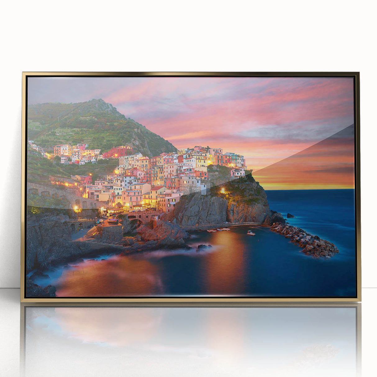 Framed acrylic wall art depicting a serene village landscape with vibrant colors, elegant gold frame, perfect for home decor. Ideal for creating a warm atmosphere.