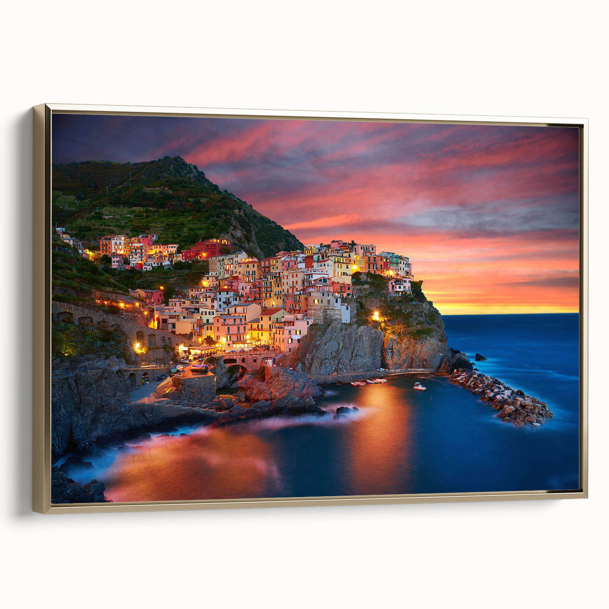 Framed canvas wall art showcasing a picturesque village landscape design with gold accents, ideal for home decor, adding a touch of elegance and warmth.
