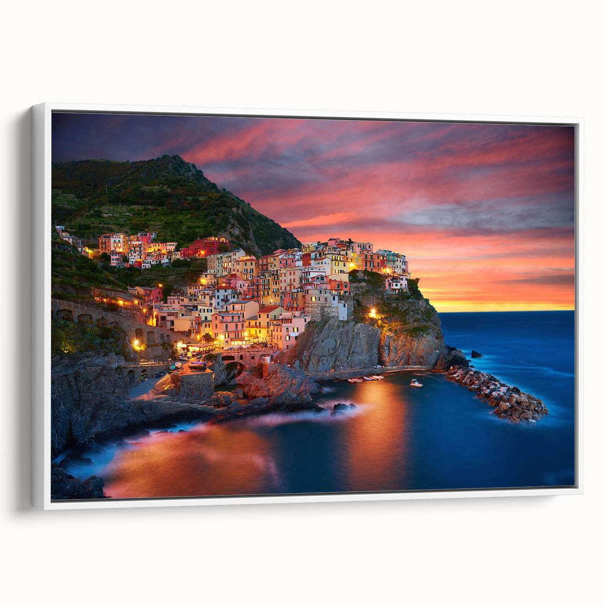 Framed canvas wall art showcasing a serene village landscape design with vibrant colors and detailed textures, set against a white background for modern decor.