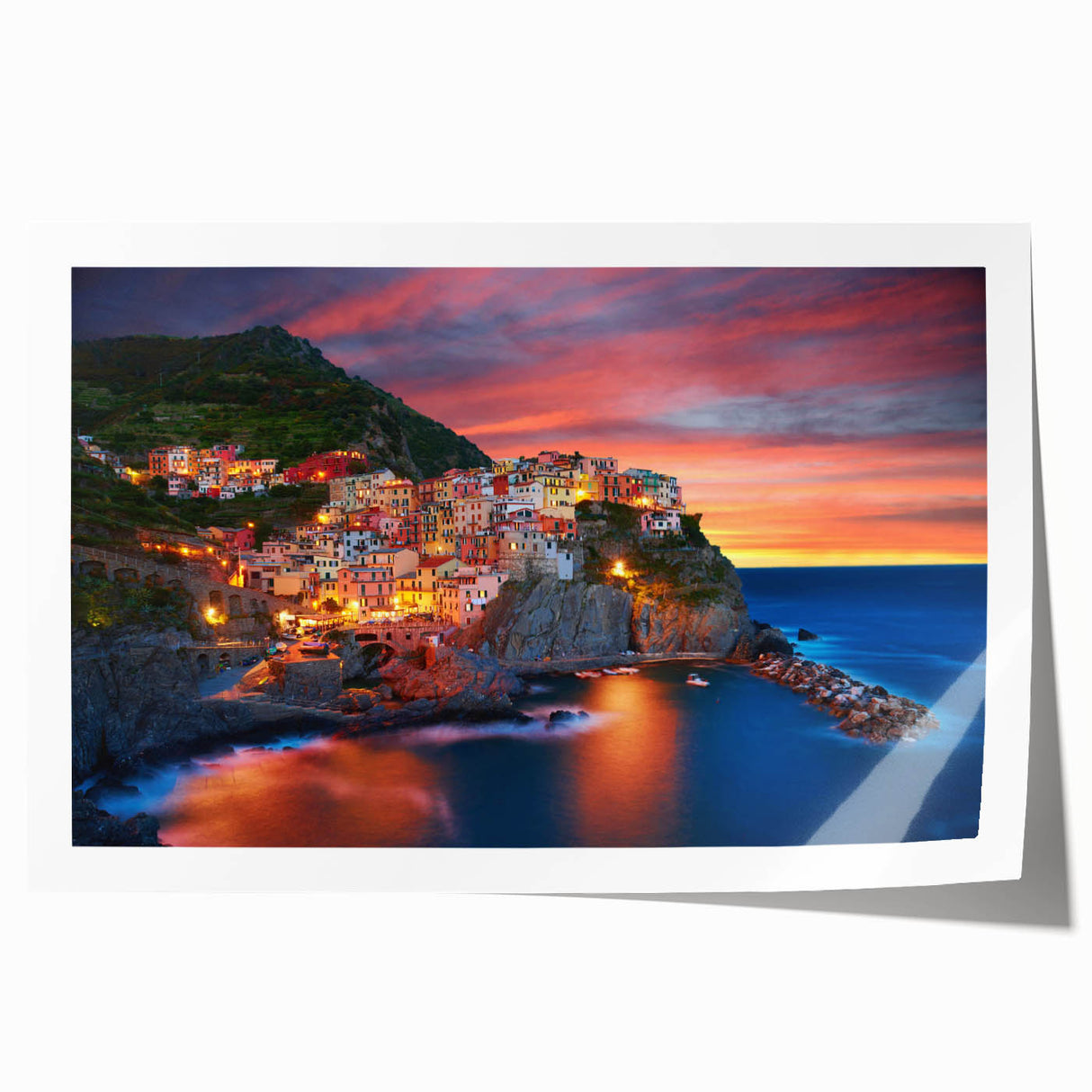 Vibrant rolled print showcasing a picturesque village landscape with lush greenery and charming cottages, ideal for home decor or artistic display.