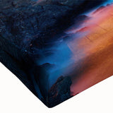 Close-up of a stretched canvas wall art piece depicting a vibrant village landscape design with rich colors and intricate details, perfect for home decor.