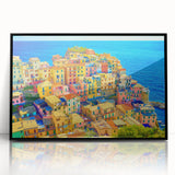 Framed acrylic wall art showcasing a vibrant landscape of a village, featuring lush greenery and colorful homes, designed to enhance modern decor.