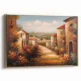 Framed canvas wall art showcasing a picturesque landscape of a charming village, featuring vibrant colors and a gold frame, perfect for enhancing home decor.