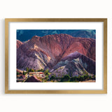 Framed wall art collection showcasing a vibrant landscape of charming villages, highlighted by a gold mat and intricate details, ideal for home decor.