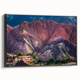 Framed canvas wall art showcasing a serene village landscape design with vibrant colors and intricate details, displayed from a black side view for a modern aesthetic.