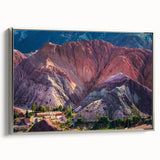 Framed canvas wall art showcasing a serene village landscape with vibrant colors, silver frame, and a contemporary design, perfect for home decor.