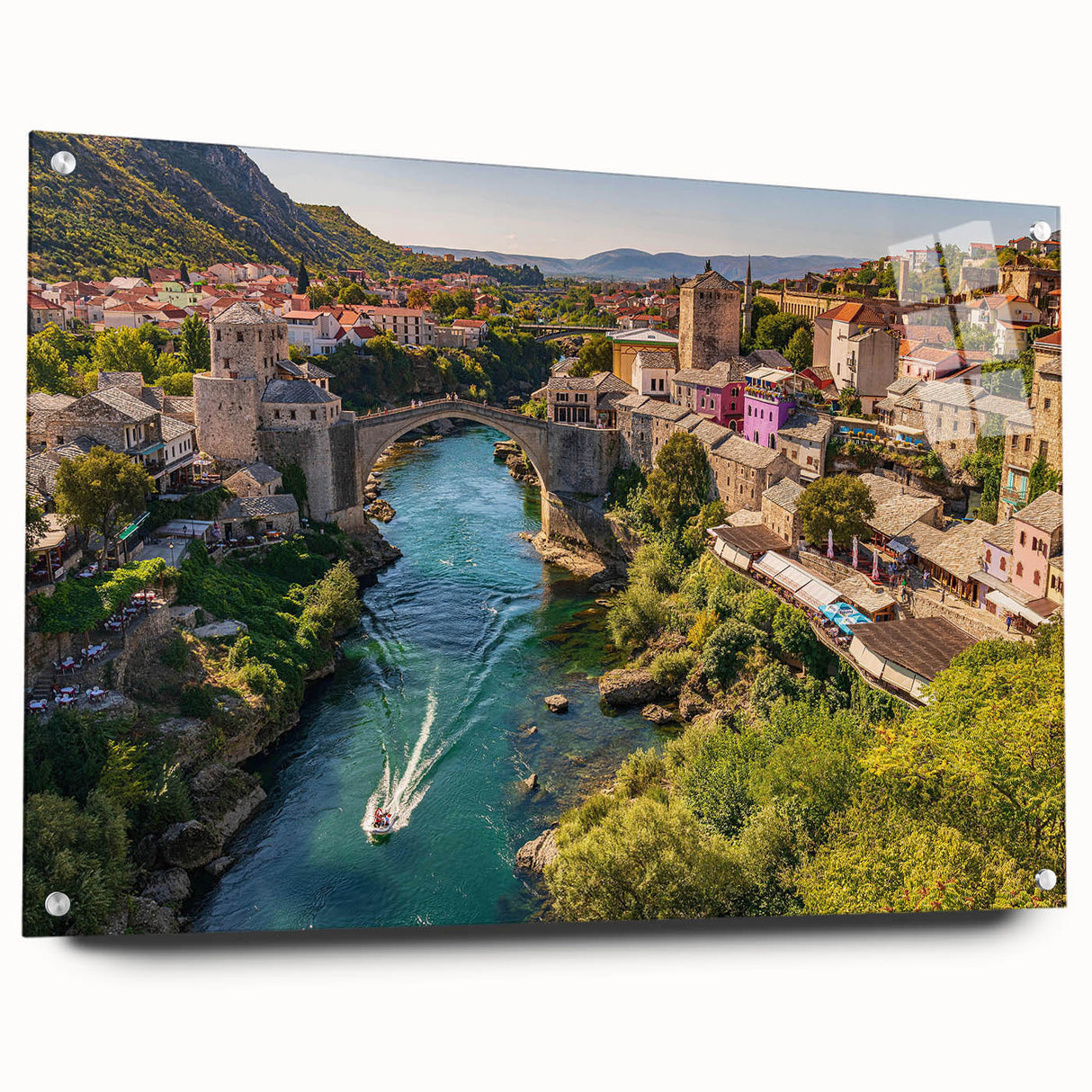 Acrylic glass wall art collection showcasing a scenic landscape with vibrant village designs, featuring a side view and decorative pins for hanging.