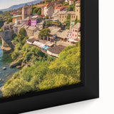 Framed canvas wall art depicting a vibrant landscape village scene, showcasing rich colors and intricate details, perfect for home decor enthusiasts.