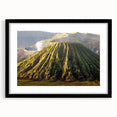 Framed wall art featuring a vibrant volcano landscape design, set in a sleek black frame with a mat, ideal for enhancing home decor with natural beauty.
