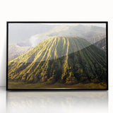 Framed acrylic wall art showcasing a dramatic volcano landscape design in vibrant colors, set against a sleek black frame, ideal for modern home decor.