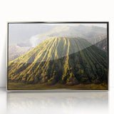 Framed acrylic wall art featuring a striking volcano landscape design with vibrant colors, set in a sleek silver frame, ideal for modern decor. This artwork enhances any room with its dynamic colors and captivating natural scenery.