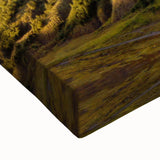 Close-up of a vibrant stretched canvas wall art piece depicting a dramatic volcanic landscape, showcasing bold colors and intricate textures, perfect for home decor.