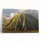 Vibrant landscape wall art featuring a dramatic volcano scene, printed on stretched canvas and leaning against a textured wall, ideal for home decor.