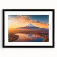 Framed wall art collection showcasing a vibrant volcano landscape design, featuring a sleek black frame and mat, perfect for modern home decor.