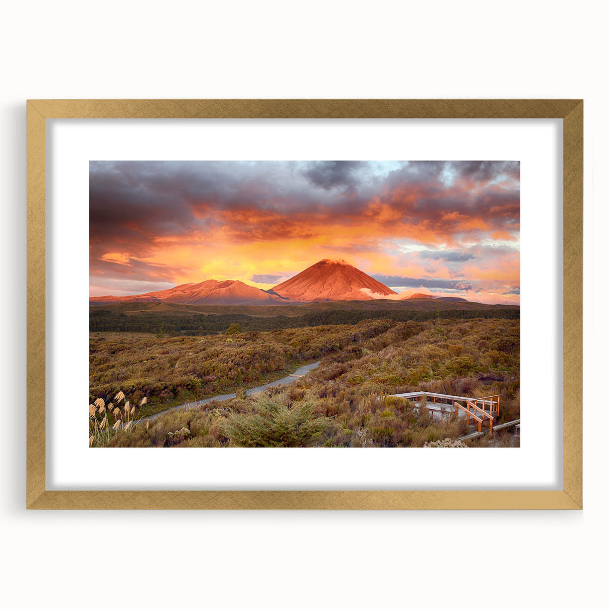 Framed wall art featuring a vibrant volcano landscape design in gold frame with matting, perfect for adding a striking focal point to any room decor.