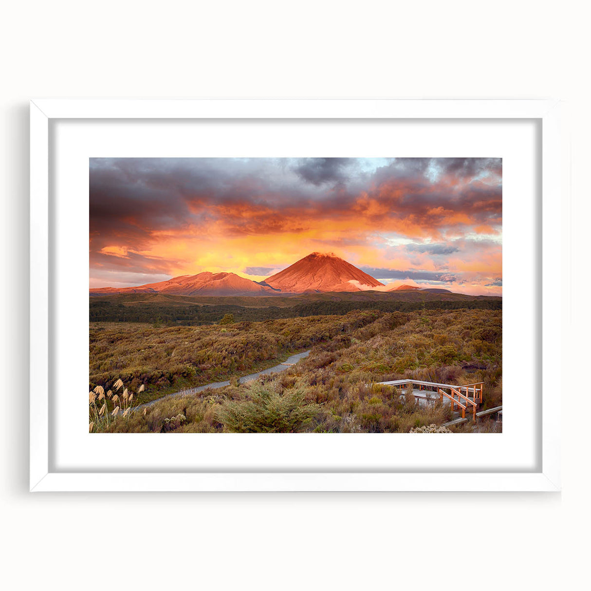 Stunning framed wall art featuring a vibrant volcano landscape design, set in a sleek white frame with a mat, perfect for enhancing modern home decor.